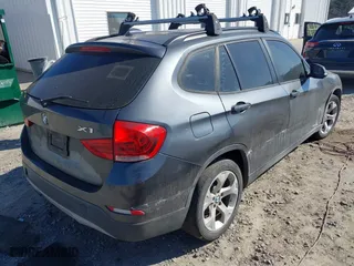 2014 BMW X1 sDrive28i with VIN WBAVM1C57EVW52502, listed as a IAAI auction lot 41702746 with 165,089 mi miles. Bid and sale history available at carsss.com. Image 4.