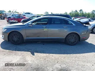 2017 Lincoln MKZ Reserve z VIN 3LN6L5E98HR653592, wystawiony jako IAAI lot #42531248 z przebiegiem 114 188 mil mil oraz . Historia ofert i sprzedaży dostępna na DreamBid. Obrazek 14.