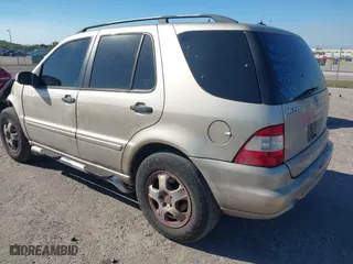 2003 Mercedes-Benz M-Class 3.7L with VIN 4JGAB57E23A453057, listed as a IAAI auction lot 41704721 with 190,649 mi miles. Bid and sale history available at carsss.com. Image 3.