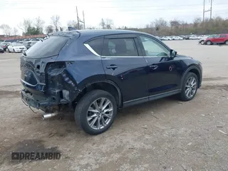 2021 Mazda CX-5 Grand Touring with VIN JM3KFADM0M1321375, listed as a IAAI auction lot 41913449 with 88,178 mi miles. Bid and sale history available at carsss.com. Image 4.