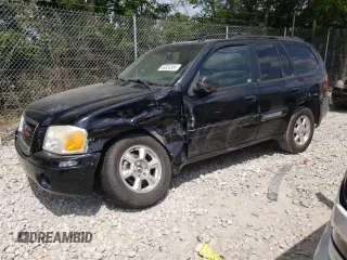 2004 GMC Envoy SLT with VIN 1GKDT13S042281050, listed as a Copart auction lot 60024304 with 267,205 mi miles and Salvage Title. Bid and sale history available at carsss.com. Image 1.