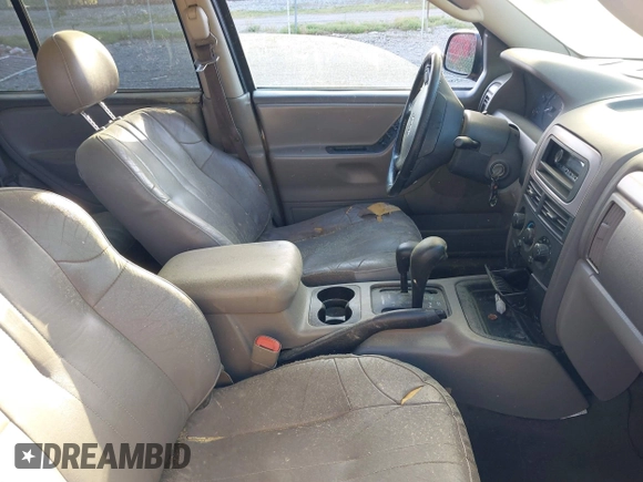 2002 Jeep Grand Cherokee with VIN 1J4GW38N42C202219, listed as a IAAI auction lot 42035162 with 220,012 mi miles and . Bid and sale history available at DreamBid. Image 5.