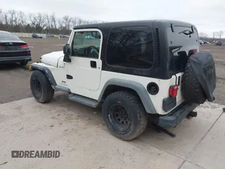 2005 Jeep Wrangler Sport with VIN 1J4FA49S25P352170, listed as a IAAI auction lot 41794958 with 154,304 mi miles. Bid and sale history available at carsss.com. Image 3.