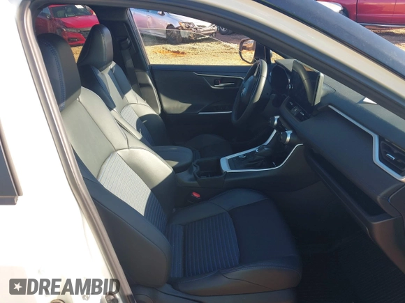 2023 Toyota RAV4 Hybrid XSE with VIN 2T3E6RFV1PW038080, listed as a IAAI auction lot 42518107 with 14,430 mi miles and . Bid and sale history available at DreamBid. Image 5.
