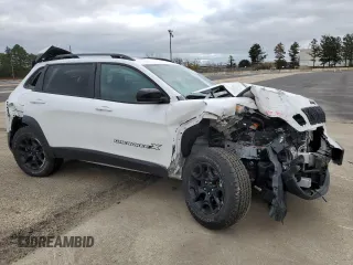2022 Jeep Cherokee X with VIN 1C4PJMCX5ND528984, listed as a Copart auction lot 80225644 with 50,588 mi miles and Salvage Title. Bid and sale history available at carsss.com. Image 4.