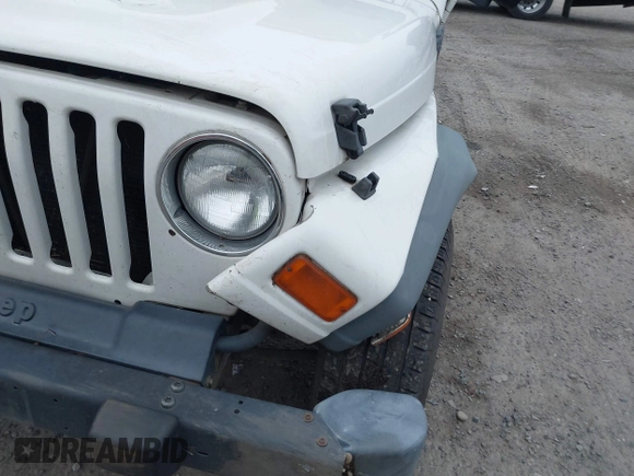 2006 Jeep Wrangler Sport Right Hand Drive with VIN 1J4F449S16P709895, listed as a IAAI auction lot 41349311 with 157,125 mi miles. Bid and sale history available at carsss.com. Image 19.