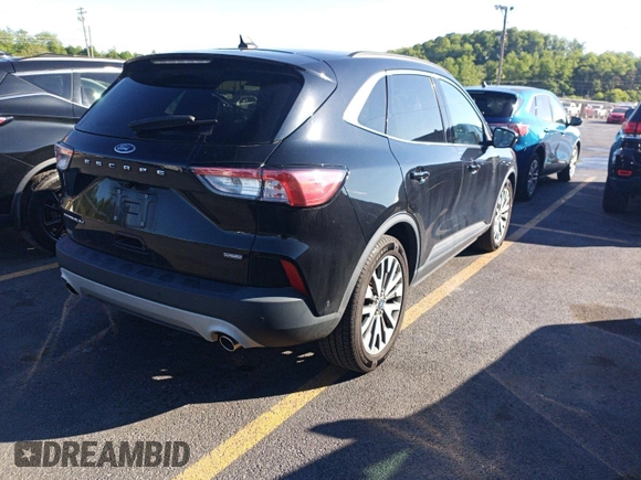 2020 Ford Escape Titanium Hybrid with VIN 1FMCU0DZ6LUC02215, listed as a IAAI auction lot 42631411 with 88,615 mi miles and . Bid and sale history available at DreamBid. Image 1.