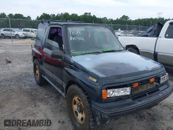 1995 Geo Tracker z VIN 2CNBE18U0S6943292, wystawiony jako IAAI lot #41274067 z przebiegiem Nie podano mil oraz . Historia ofert i sprzedaży dostępna na DreamBid. Obrazek 2.