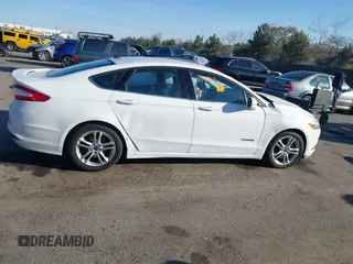 2015 Ford Fusion SE Hybrid with VIN 3FA6P0LU3FR249444, listed as a IAAI auction lot 41602659 with 145,024 mi miles. Bid and sale history available at carsss.com. Image 13.