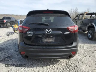 2016 Mazda CX-5 Touring z VIN JM3KE4CY0G0667171, wystawiony jako Copart lot #51579005 z przebiegiem 39 487 mil mil oraz Szkoda całkowita • Salvage title. Historia ofert i sprzedaży dostępna na DreamBid. Obrazek 6.