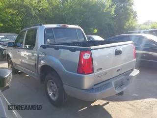 2003 Ford Explorer Sport Trac XLS z VIN 1FMZU67EX3UB19974, wystawiony jako IAAI lot #42563671 z przebiegiem 133 452 mil mil oraz . Historia ofert i sprzedaży dostępna na DreamBid. Obrazek 3.