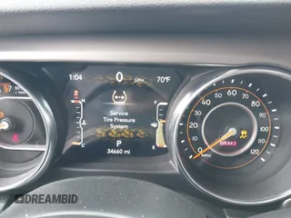 2020 Jeep Gladiator Sport S z VIN 1C6HJTAG4LL153441, wystawiony jako IAAI lot #42052329 z przebiegiem 34 660 mil mil oraz . Historia ofert i sprzedaży dostępna na DreamBid. Obrazek 7.