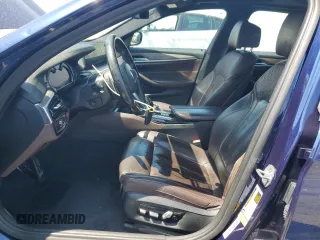 2018 BMW 5 Series 540i with VIN WBAJE5C51JWA94673, listed as a Copart auction lot 59807825 with 77,051 mi miles and Salvage title. Bid and sale history available at DreamBid. Image 7.