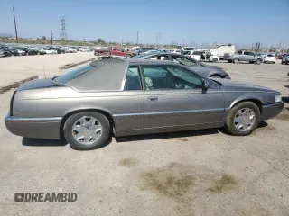 1998 Cadillac Eldorado z VIN 1G6EL12YXWU610918, wystawiony jako Copart lot #57309075 z przebiegiem 168 228 mil mil oraz Szkoda całkowita • Salvage title. Historia ofert i sprzedaży dostępna na DreamBid. Obrazek 3.