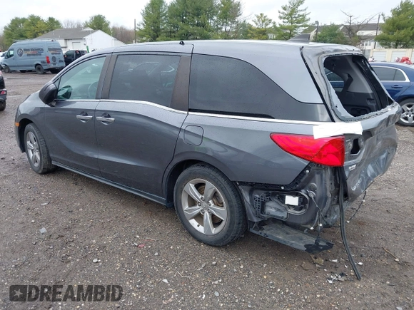 2018 Honda Odyssey EX-L z VIN 5FNRL6H70JB025227, wystawiony jako IAAI lot #41940992 z przebiegiem 95 797 mil mil oraz . Historia ofert i sprzedaży dostępna na DreamBid. Obrazek 3.