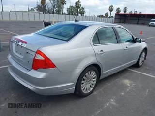 2010 Ford Fusion Hybrid with VIN 3FADP0L37AR261099, listed as a IAAI auction lot 41903543 with 160,070 mi miles. Bid and sale history available at carsss.com. Image 4.