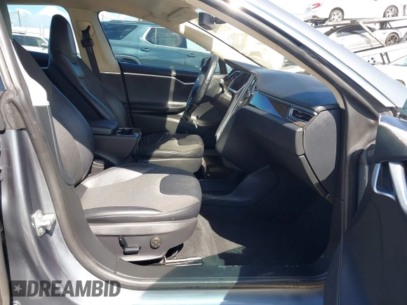 2014 Tesla Model S 60 with VIN 5YJSA1S15EFP29010, listed as a IAAI auction lot 41798180 with 142,754 mi miles and . Bid and sale history available at DreamBid. Image 5.