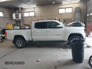 2016 Toyota Tacoma SR5 with VIN 3TMDZ5BN2GM007990, listed as a IAAI auction lot 41288736 with 76,179 mi miles. Bid and sale history available at carsss.com. Image 13.