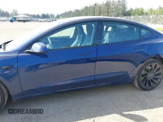 2023 Tesla Model 3 Performance with VIN 5YJ3E1EC2PF679613, listed as a IAAI auction lot 42099199 with 21,721 mi miles. Bid and sale history available at carsss.com. Image 15.