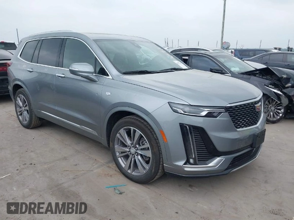 2025 Cadillac XT6 FWD Premium Luxury with VIN 1GYKPCRS4SZ119978, listed as a IAAI auction lot 41877109 with 13,579 mi miles. Bid and sale history available at carsss.com. Image 1.