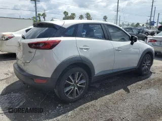 2017 Mazda CX-3 Touring z VIN JM1DKDC78H0150588, wystawiony jako Copart lot #55284205 z przebiegiem 78 923 mil mil oraz Szkoda całkowita • Salvage title. Historia ofert i sprzedaży dostępna na DreamBid. Obrazek 3.