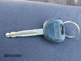 2003 Suzuki Aerio S z VIN JS2RA41SX35171394, wystawiony jako IAAI lot #40612266 z przebiegiem 70 127 mil mil oraz . Historia ofert i sprzedaży dostępna na DreamBid. Obrazek 11.