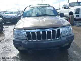 2001 Jeep Grand Cherokee Laredo with VIN 1J4GW48S21C572272, listed as a IAAI auction lot 41695754 with 169,229 mi miles. Bid and sale history available at carsss.com. Image 12.