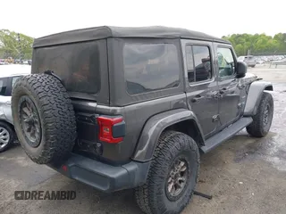 2021 Jeep Wrangler Unlimited Sahara with VIN 1C4JJXP60MW704738, listed as a IAAI auction lot 42042079 with 63,765 mi miles and . Bid and sale history available at DreamBid. Image 4.