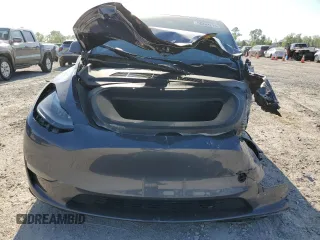 2023 Tesla Model Y Long Range z VIN 7SAYGDEE7PA199067, wystawiony jako Copart lot #52463215 z przebiegiem 30 978 mil mil oraz Szkoda całkowita • Salvage title. Historia ofert i sprzedaży dostępna na DreamBid. Obrazek 5.