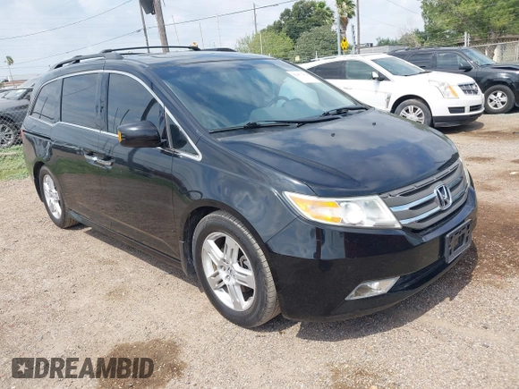 2013 Honda Odyssey Touring with VIN 5FNRL5H95DB086041, listed as a IAAI auction lot 42477974 with 213,343 mi miles and . Bid and sale history available at DreamBid. Image 1.