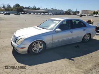 2003 Mercedes-Benz E-Class 3.2L with VIN WDBUF65JX3A096821, listed as a Copart auction lot 74378684 with 157,088 mi miles and Clean Title. Bid and sale history available at carsss.com. Image 1.