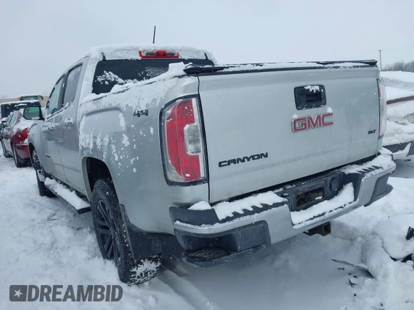 2015 GMC Canyon 4WD SLT with VIN 1GTG6CE36F1257975, listed as a IAAI auction lot 41607688 with 127,523 mi miles. Bid and sale history available at carsss.com. Image 3.