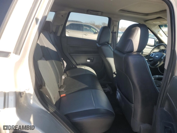 2010 Jeep Grand Cherokee Laredo with VIN 1J4RR4GT1AC106990, listed as a Copart auction lot 87421664 with 106,025 mi miles and Salvage Title. Bid and sale history available at carsss.com. Image 10.