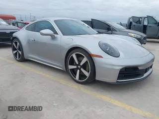 2025 Porsche 911 Carrera z VIN WP0AA2A90SS206758, wystawiony jako IAAI lot #41308544 z przebiegiem 2 482 mil mil oraz . Historia ofert i sprzedaży dostępna na DreamBid. Obrazek 1.