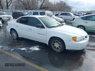 1999 Pontiac Grand Am SE1 with VIN 1G2NE52E3XM837376, listed as a IAAI auction lot 41552372 with 1 mi miles. Bid and sale history available at carsss.com. Image 1.