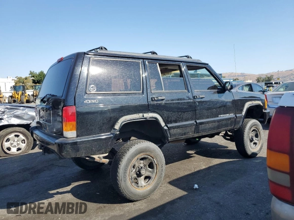 1998 Jeep Cherokee Sport with VIN 1J4FT68S8WL134461, listed as a Copart auction lot 74005704 with 0 mi miles and Salvage Title. Bid and sale history available at carsss.com. Image 3.