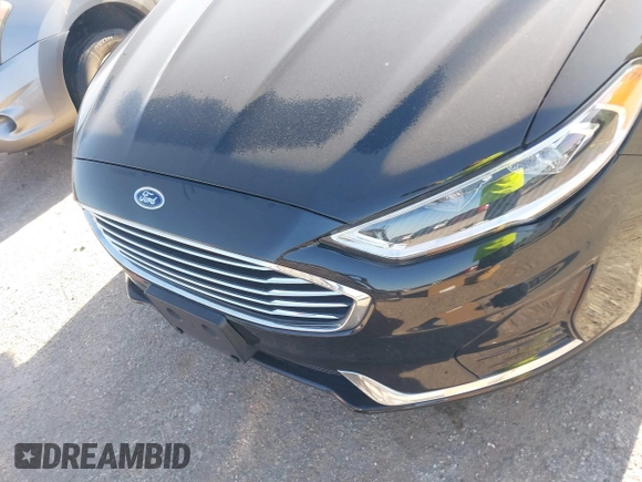2019 Ford Fusion SEL with VIN 3FA6P0MU5KR203851, listed as a IAAI auction lot 41982637 with 96,954 mi miles and . Bid and sale history available at DreamBid. Image 6.