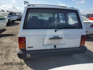 1993 Jeep Cherokee Sport with VIN 1J4FJ68S4PL555701, listed as a Copart auction lot 76020714 with 130,884 mi miles and Salvage Title. Bid and sale history available at carsss.com. Image 6.