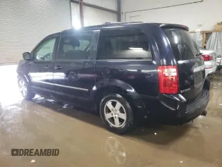 2010 Dodge Grand Caravan SXT with VIN 2D4RN5D15AR140564, listed as a Copart auction lot 52735825 with 187,744 mi miles and Salvage Title. Bid and sale history available at DreamBid. Image 2.