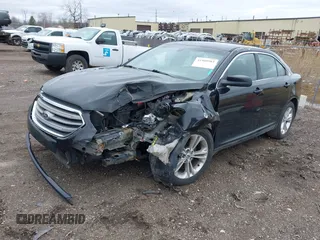 2014 Ford Taurus SEL with VIN 1FAHP2E80EG114996, listed as a IAAI auction lot 41908983 with 136,864 mi miles. Bid and sale history available at carsss.com. Image 2.