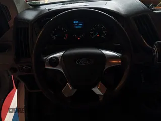 2016 Ford Transit Cargo z VIN 1FTYE1YM3GKB15532, wystawiony jako IAAI lot #42788480 z przebiegiem 64 600 mil mil oraz . Historia ofert i sprzedaży dostępna na DreamBid. Obrazek 21.