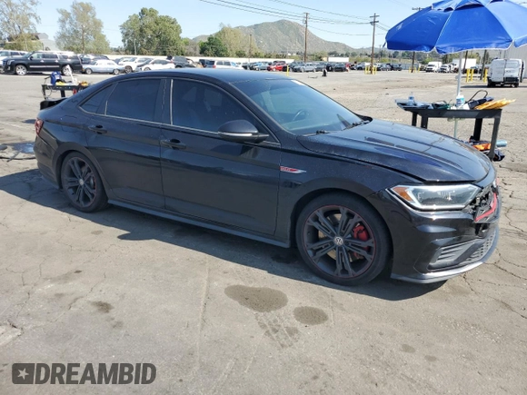2019 Volkswagen Jetta GLI S with VIN 3VW5T7BU9KM143452, listed as a Copart auction lot 52015965 with 115,652 mi miles and Salvage title. Bid and sale history available at DreamBid. Image 4.