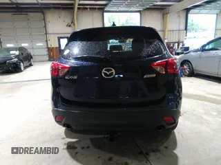 2016 Mazda CX-5 Sport with VIN JM3KE2BY5G0782385, listed as a IAAI auction lot 41971163 with 87,251 mi miles. Bid and sale history available at carsss.com. Image 17.