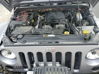 2013 Jeep Wrangler Unlimited Rubicon with VIN 1C4BJWFG5DL661282, listed as a Copart auction lot 57471035 with 128,400 mi miles and Salvage title. Bid and sale history available at DreamBid. Image 12.