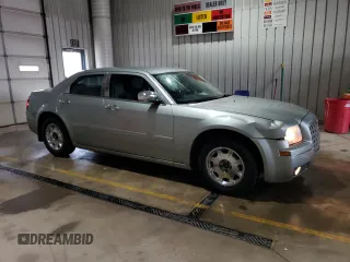 2005 Chrysler 300 with VIN 2C3JA53G65H556313, listed as a Copart auction lot 51839305 with 124,358 mi miles and Salvage Title. Bid and sale history available at carsss.com. Image 4.