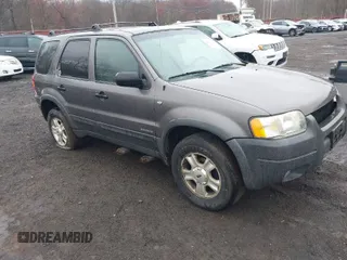 2002 Ford Escape XLT Choice with VIN 1FMYU04122KC36937, listed as a IAAI auction lot 42014887 with 141,885 mi miles. Bid and sale history available at carsss.com. Image 1.