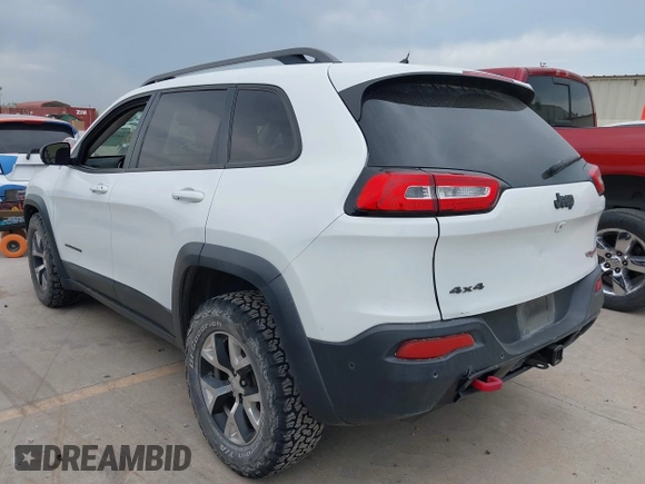 2015 Jeep Cherokee Trailhawk with VIN 1C4PJMBS9FW623740, listed as a IAAI auction lot 42131019 with 155,105 mi miles and . Bid and sale history available at DreamBid. Image 3.