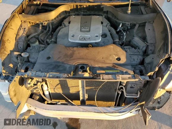 2013 Infiniti FX z VIN JN8CS1MU3DM140055, wystawiony jako Copart lot #80255094 z przebiegiem 153 575 mil mil oraz Szkoda całkowita • Salvage title. Historia ofert i sprzedaży dostępna na DreamBid. Obrazek 11.