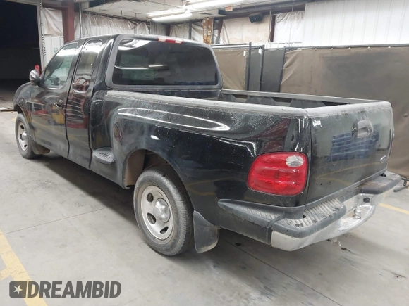 2001 Ford F-150 XL with VIN 1FTRX07W61KF82074, listed as a IAAI auction lot 41444721 with 125,494 mi miles. Bid and sale history available at carsss.com. Image 3.