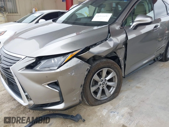 2018 Lexus RX 350 z VIN 2T2BZMCA3JC151296, wystawiony jako IAAI lot #41331203 z przebiegiem 73 051 mil mil oraz . Historia ofert i sprzedaży dostępna na DreamBid. Obrazek 6.